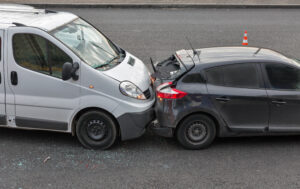 white work van rear-end car accident with a black hatchback in Oklahoma city