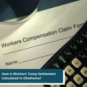 a workers compensation claim form together with a calculator